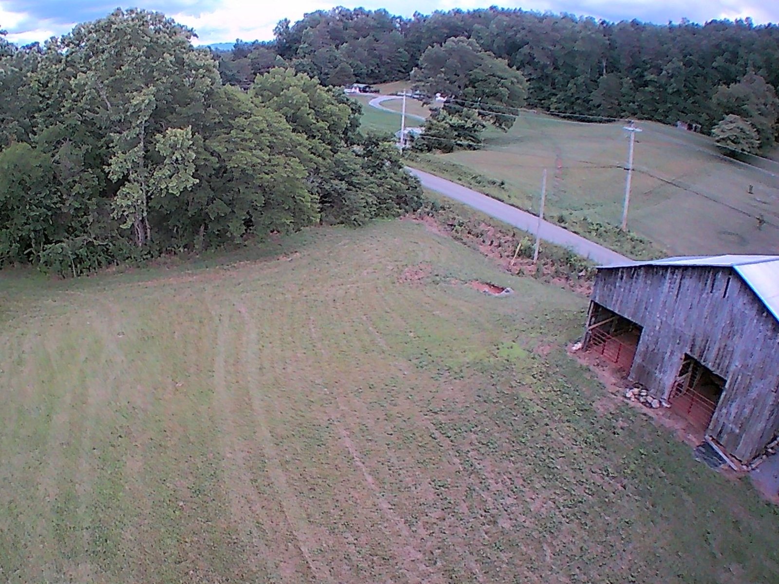 Aerial view of the hay field and the old barn